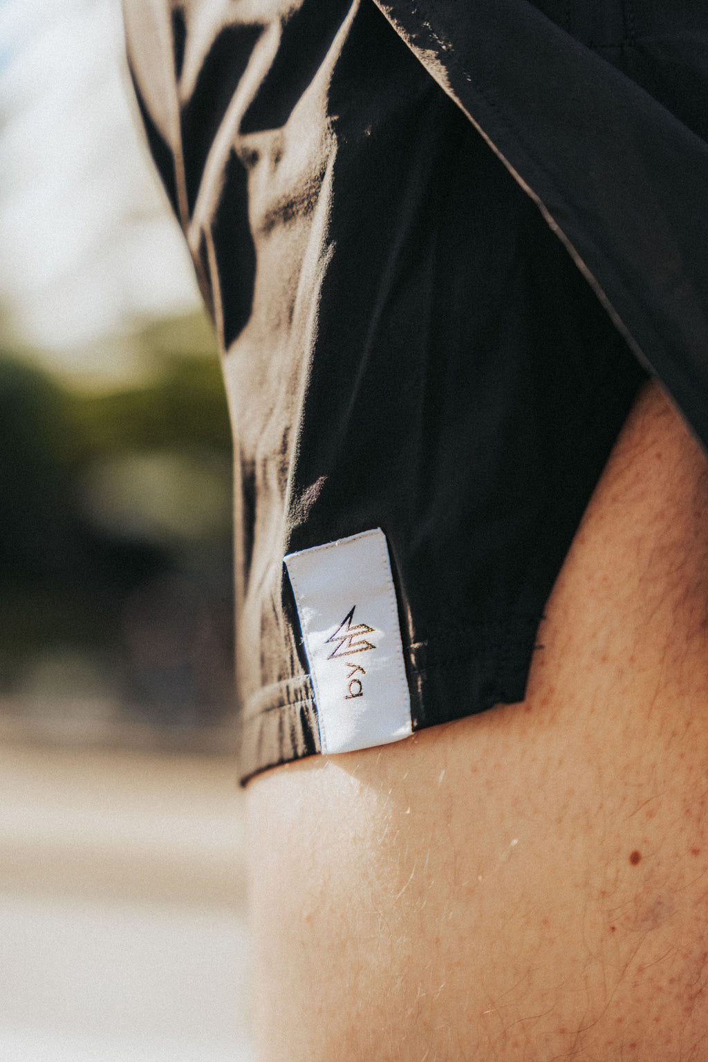 Close-up of a sport shorts with a brand logo on a blurred background