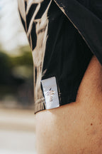 Close-up of a sport shorts with a brand logo on a blurred background